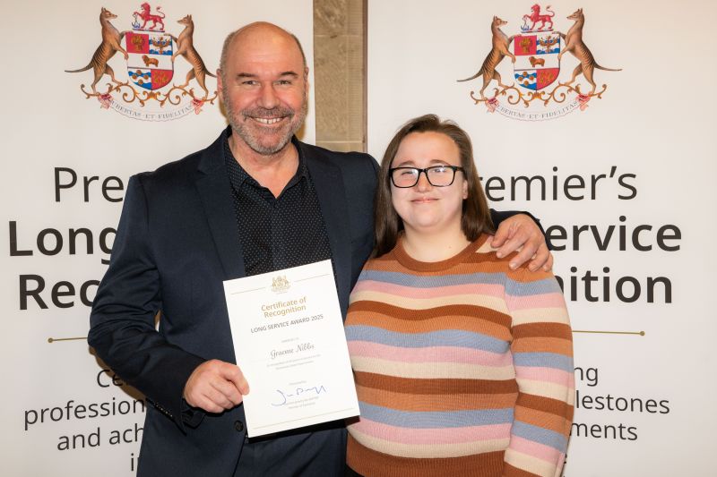 An award recipient poses with his family member at the southern 2025 event