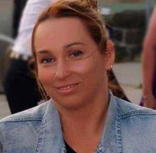 A head and shoulders photo of Alyse Gavlik who has her hair tied back and is wearing a denim jacket