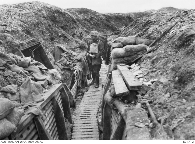 Captain Morris standing in a trench near tunnel entrance