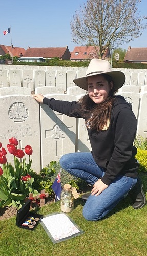 Jenna Stacey preparing a tribute at grave