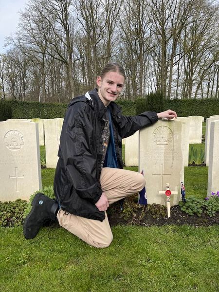 Photo of Harry at the gravestone of his great-great-grandfather Harold George