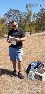 Phil Stanley standing near a memorial plaque