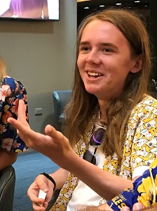 Rowan Wheeler communicating and holds out his hand to express information