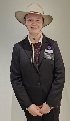 Erin Rowlands is wearing an Akubra hat and a uniform