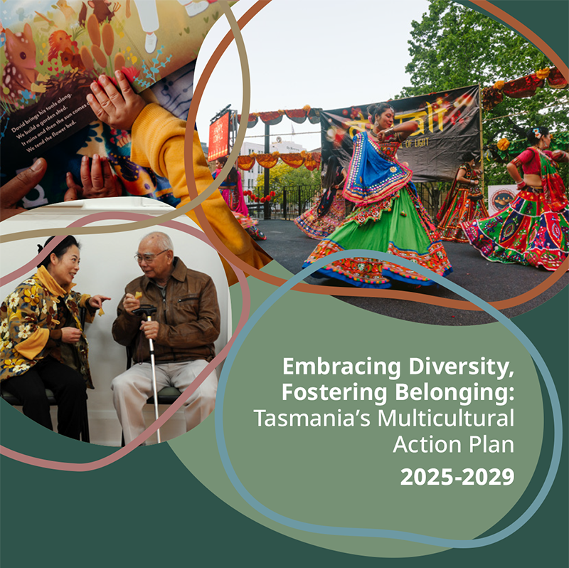 A group of culturally and linguistically diverse people, some wearing national dress, at a community event