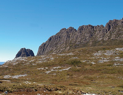 wilderness setting with mountain range in background